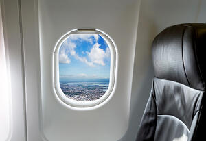 Beautiful landscape through aircraft window onto jet engine