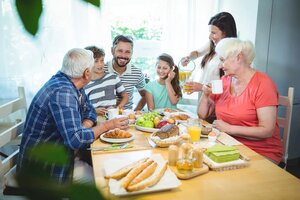 Happy multi-generation family sitting at breakfast table