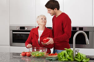 Grandma and granson enjoy cooking together