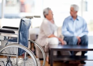 Lovely retired couple talking on the sofa