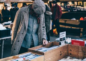 woman looking at used books on the street
