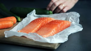 salmon filets on cutting board