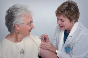 older woman receiving shot