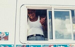 older man working in ice cream truck