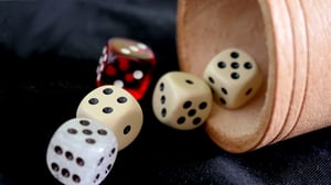 yahtzee five dice and cup