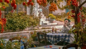 older man sitting outside in the fall, octoberfest
