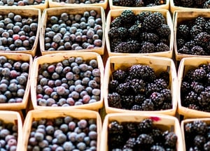 blueberries and blackberries in baskets