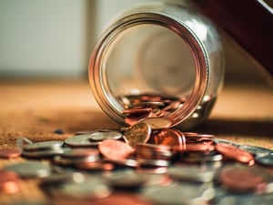 coin jar spilling on table 