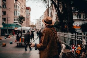 man-in-brown-jacket-and-brown-hat-standing-on-sidewalk-with-4031864 (1)