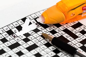 crossword puzzle in pen, white-out