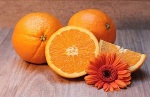 oranges, orange slices on table