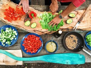 person-holding-sliced-vegetables