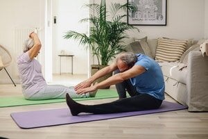 older couple working out together at home