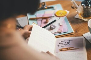 older woman journaling writing