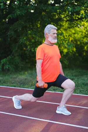 older adult doing lunge exercise