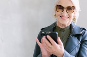 Senior woman on mobile phone with sunglasses