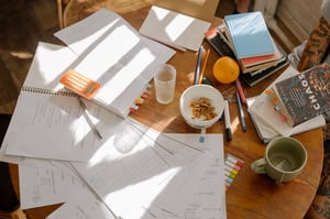 paper clutter on table