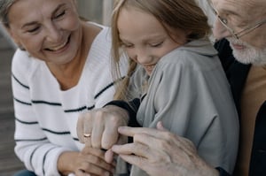 grandparents and grandchild smiling