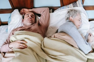 couple sleeping in bed