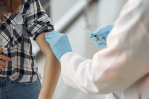 Woman receiving vaccination 