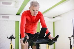 man participating in spin class