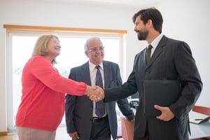 older couple meeting with realtor