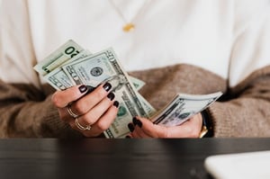 older woman counting money budget