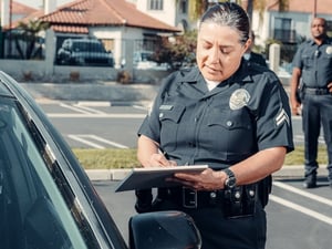 police officer writing a ticket