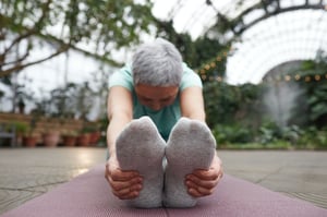 older woman stretching 