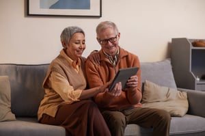 older couple participating in virtual tour on tablet