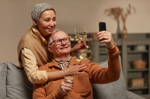 older couple on video call with their children