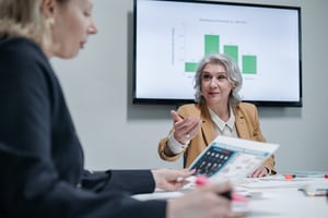 older woman at work business presentation