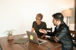 son helping older mother research long-term care insurance options