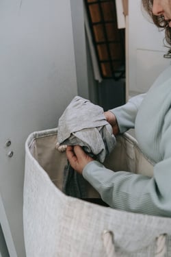 Older woman sorting clothes