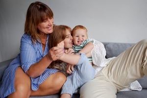 baby, mother, and grandmother on couch