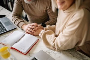 older couple sitting down to plan future together