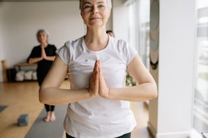 older woman participating in a group fitness class