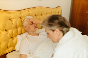 older man in bed struggling to sleep