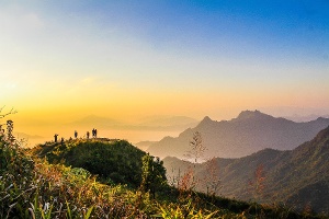 photo-of-people-standing-on-top-of-mountain-near-grasses-733162-1