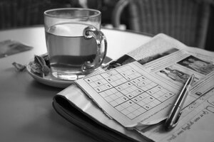 relaxing tea and sudoku on table
