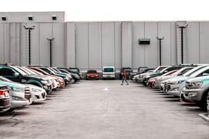 woman walking to her car in a parking lot