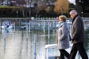 older couple walking near water