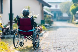 Older woman with dementia sitting a wheelchair