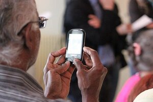 older man using mobile cell phone