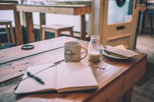 open notebook food jourmal on table 